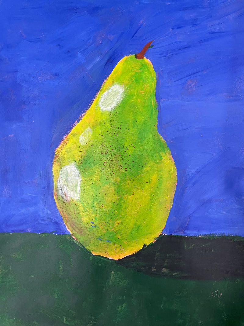 A bold acrylic painting of a green and yellow pear against a bright blue background, resting on a dark green surface. The pear features white highlight spots, small brown speckles, and a short brown stem, giving it a rounded, three-dimensional appearance.