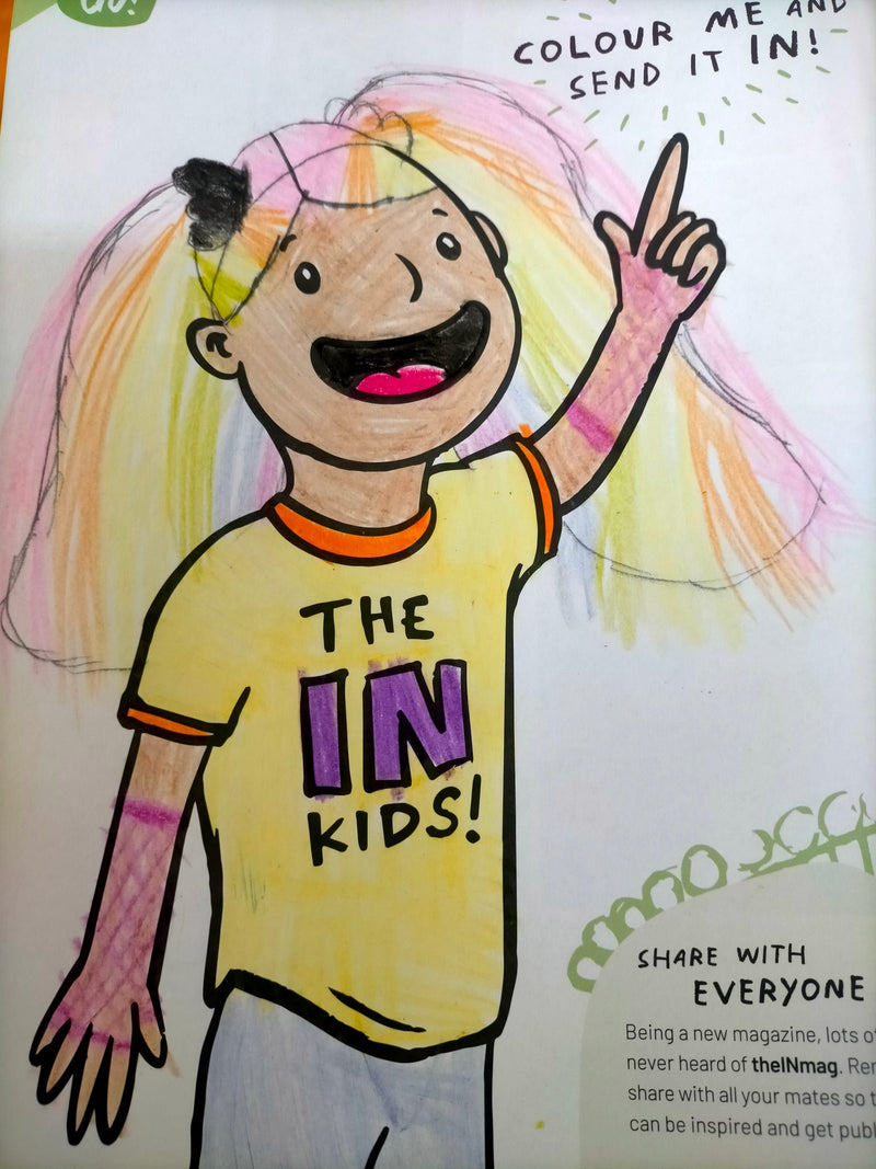 A coloured-in cartoon drawing of a cheerful child with long rainbow-coloured hair, wearing a yellow t-shirt that reads 'The IN Kids!', pointing one finger upward and smiling broadly.