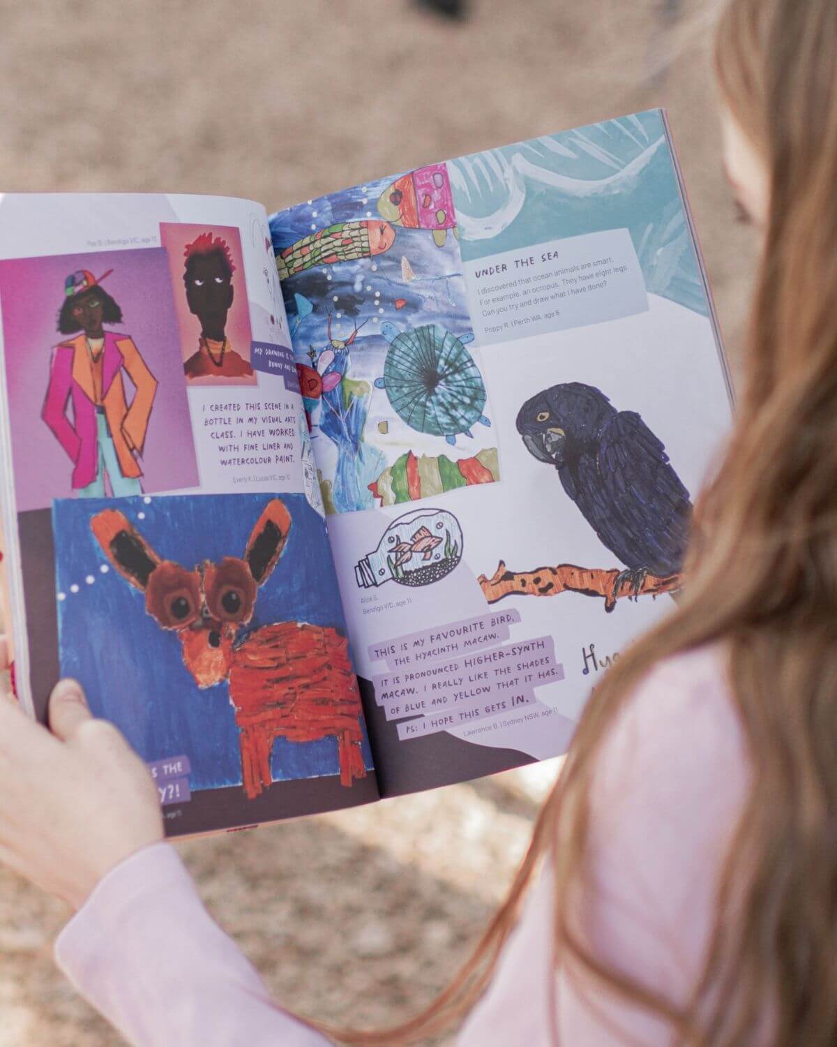 An Australian child reading theINmag, the magazine for creative kids.
