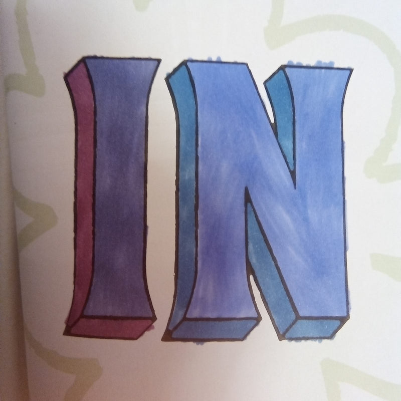 Hand-drawn block letters spelling 'IN' in a bold 3D style, coloured with purple, blue, and pink markers on white paper. The letters have shaded sides giving them a dimensional appearance.