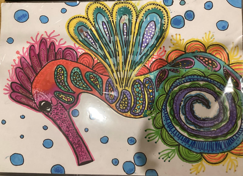 A colourful illustrated seahorse decorated with intricate paisley and swirl patterns in teal, purple, orange, and pink. The background is white with blue watercolour bubbles, and the seahorse's tail curls into a detailed spiral of green, blue, and purple.