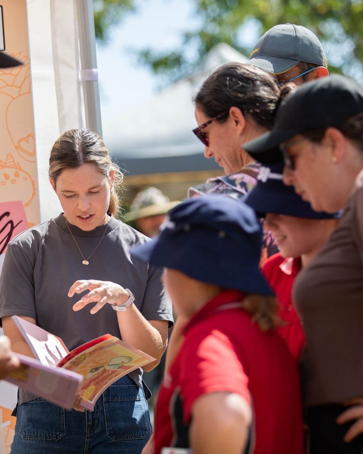 An Australian parent reading theINmag with their child.