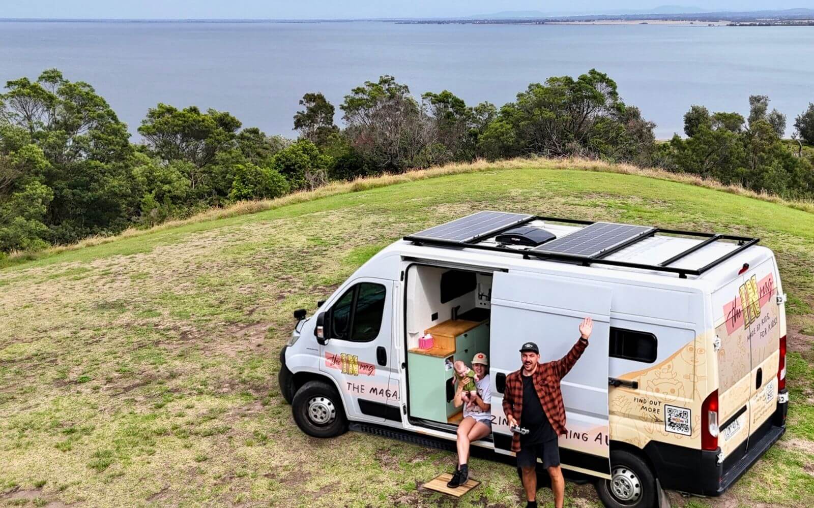 The van mid-conversion, plywood walls and wiring exposed.