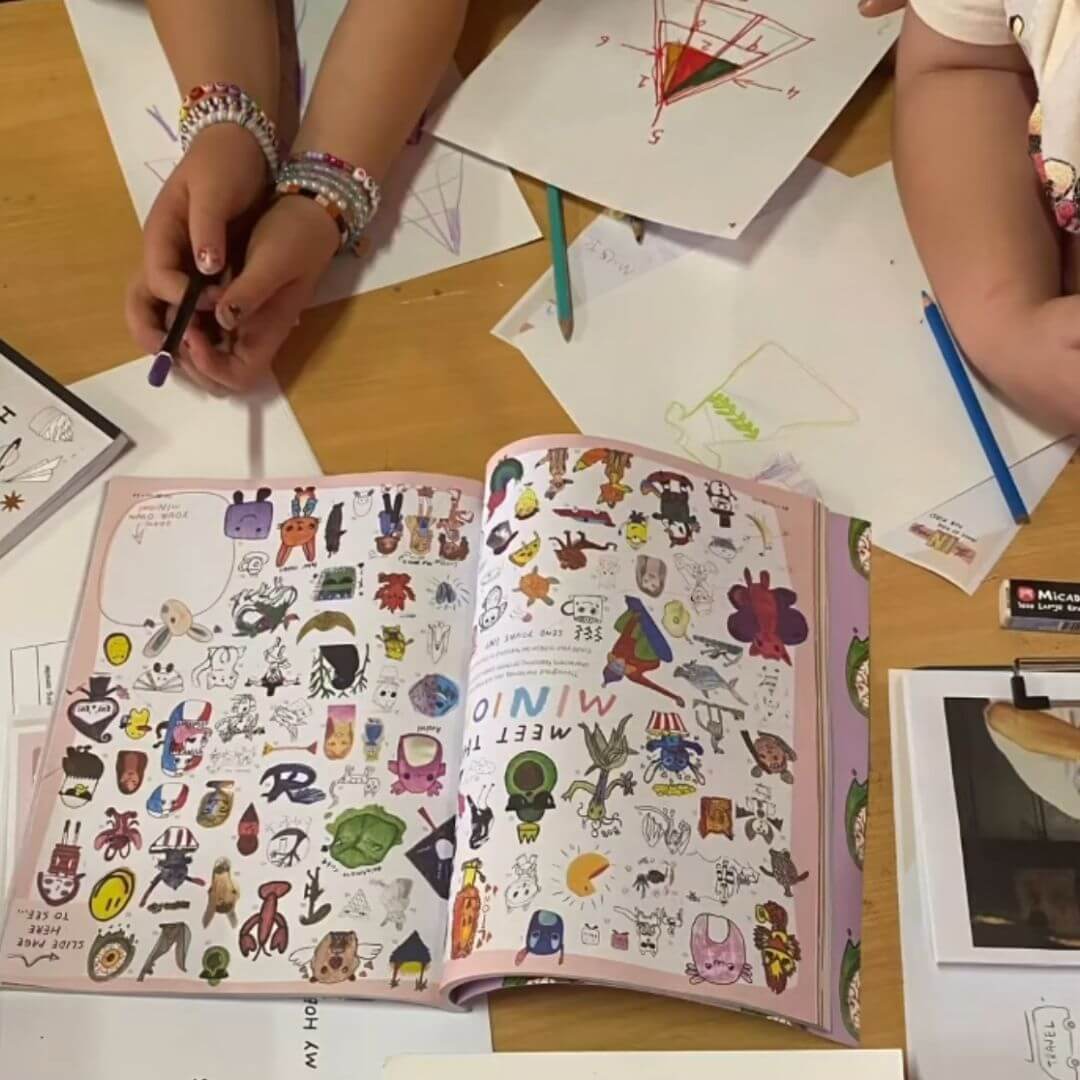 A homeschool kid reading theINmag at the kitchen table.